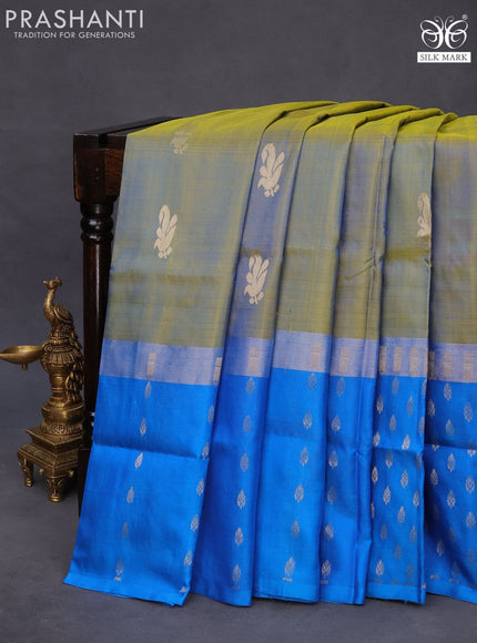 Pure uppada silk saree dual shade of yellowish blue and cs blue with zari woven buttas and long silver zari woven butta border