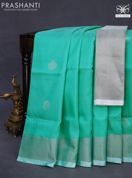 Pure uppada silk saree teal blue shade with silver zari woven coin buttas and silver zari woven border