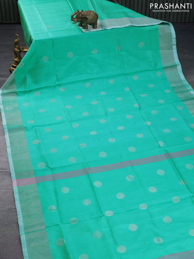 Pure uppada silk saree teal blue shade with silver zari woven coin buttas and silver zari woven border