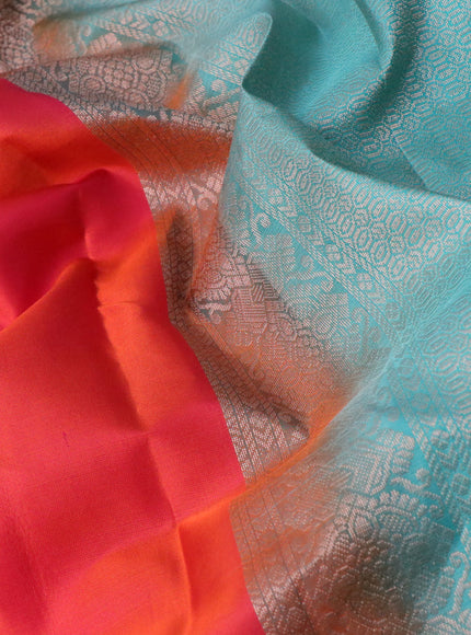 Pure kanchipuram silk saree dual shade of pinkish orange and teal green with zari woven buttas and simple border