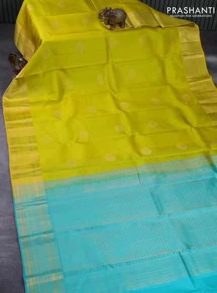 Pure kanchipuram silk saree lime yellow and teal blue with allover self emboss & zari buttas and zari woven border