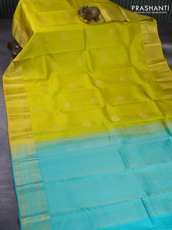 Pure kanchipuram silk saree lime yellow and teal blue with allover self emboss & zari buttas and zari woven border