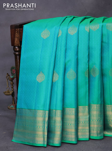 Pure kanchipuram silk saree dual shade of teal bluish green and blue with allover self emboss & zari buttas and zari woven border