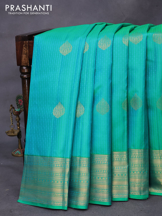 Pure kanchipuram silk saree dual shade of teal bluish green and blue with allover self emboss & zari buttas and zari woven border