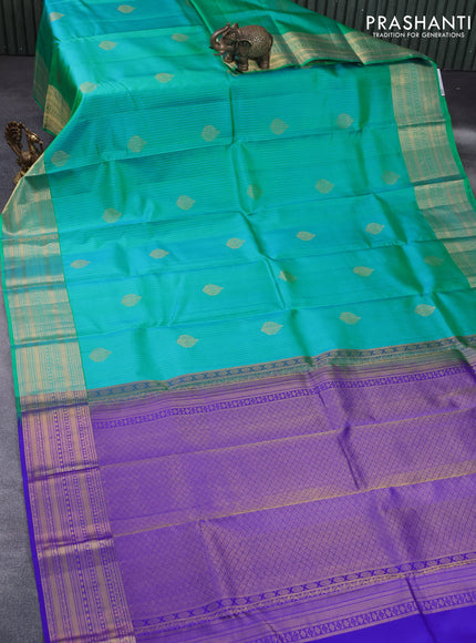 Pure kanchipuram silk saree dual shade of teal bluish green and blue with allover self emboss & zari buttas and zari woven border