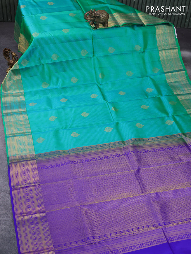 Pure kanchipuram silk saree dual shade of teal bluish green and blue with allover self emboss & zari buttas and zari woven border