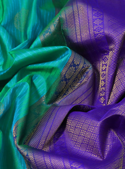 Pure kanchipuram silk saree dual shade of teal bluish green and blue with allover self emboss & zari buttas and zari woven border