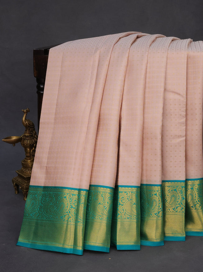 Pure kanchipuram silk saree beige and teal green with allover self emboss & zari buttas and zari woven korvai border