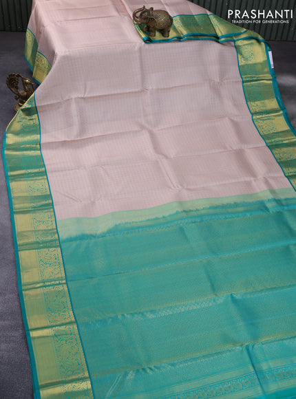 Pure kanchipuram silk saree beige and teal green with allover self emboss & zari buttas and zari woven korvai border