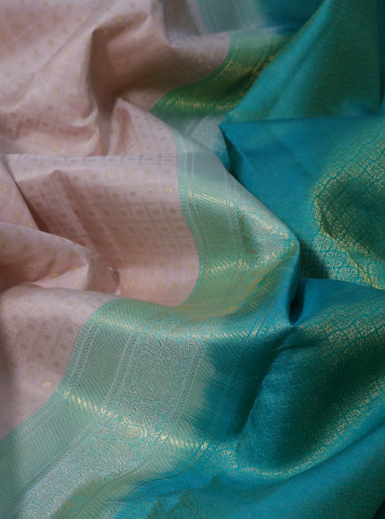 Pure kanchipuram silk saree beige and teal green with allover self emboss & zari buttas and zari woven korvai border