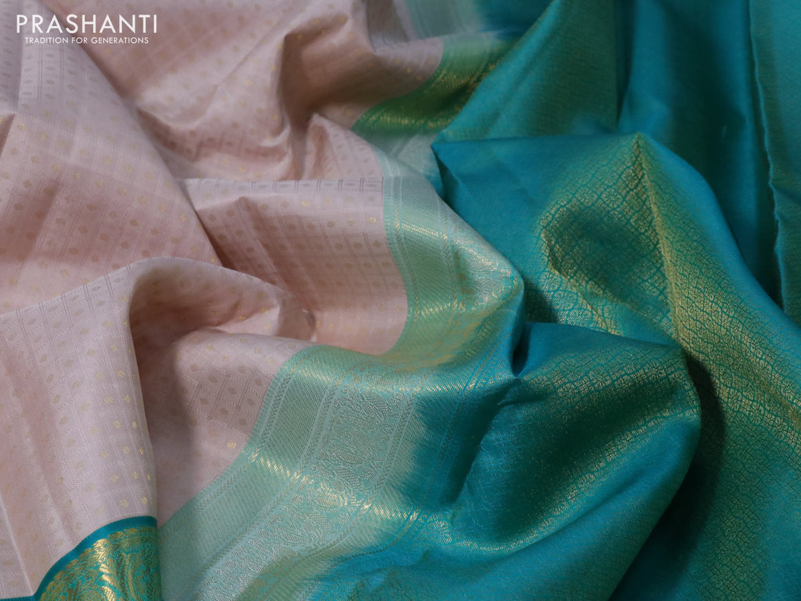 Pure kanchipuram silk saree beige and teal green with allover self emboss & zari buttas and zari woven korvai border