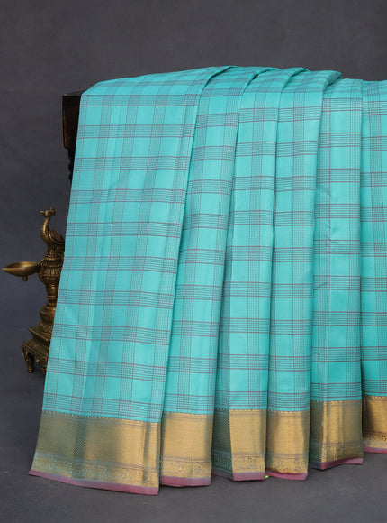 Pure kanchipuram silk saree teal blue and dark pink with allover checked pattern and zari woven korvai border