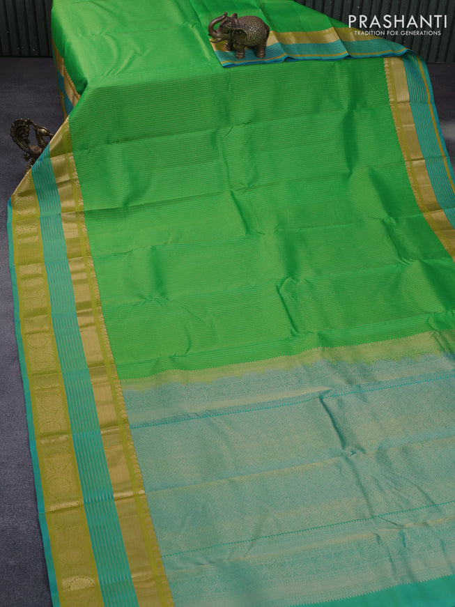 Pure kanchipuram silk saree green and dual shade of blue with allover zari woven stripe pattern and long rich zari woven border