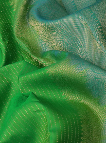 Pure kanchipuram silk saree green and dual shade of blue with allover zari woven stripe pattern and long rich zari woven border