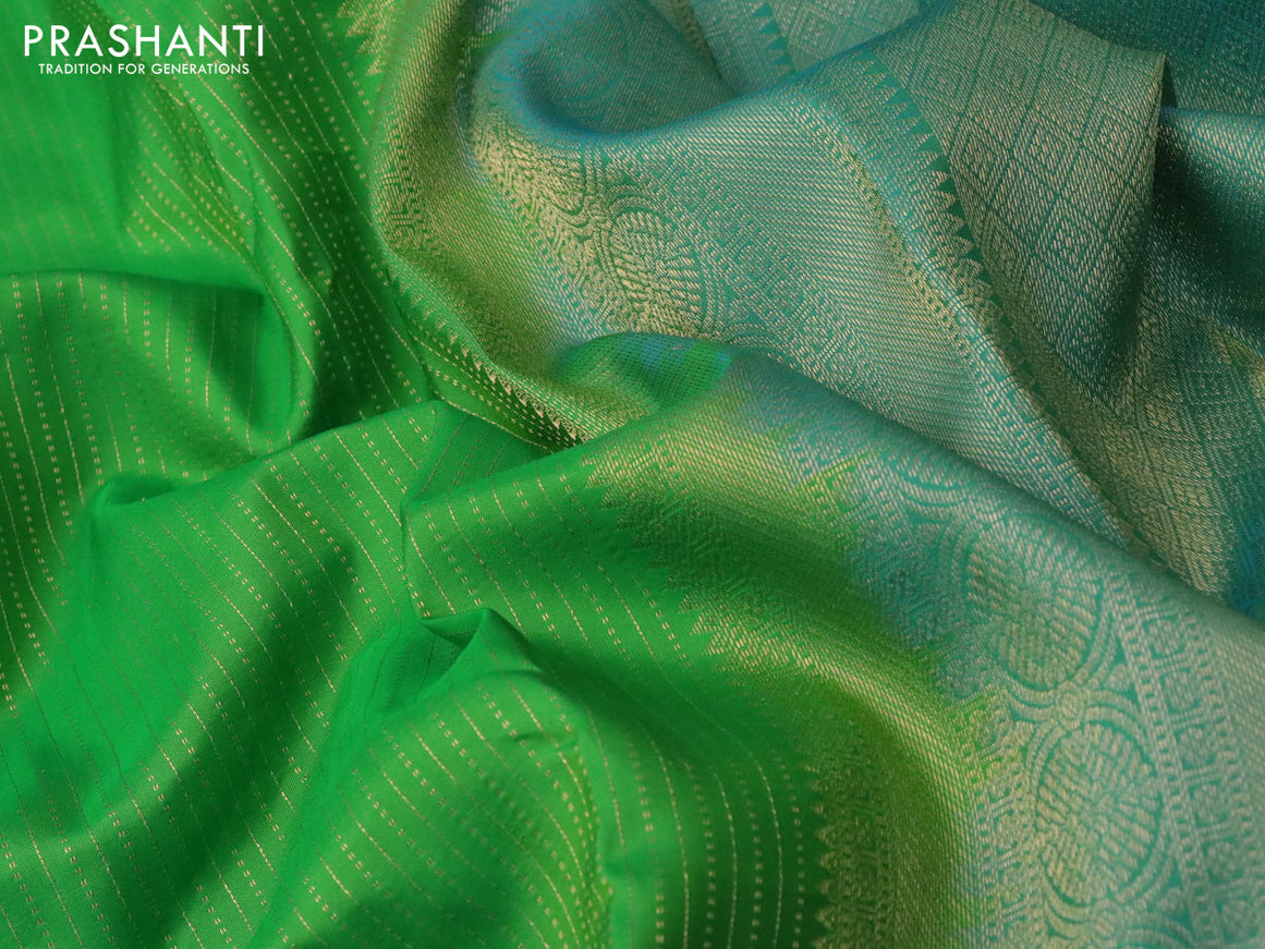 Pure kanchipuram silk saree green and dual shade of blue with allover zari woven stripe pattern and long rich zari woven border