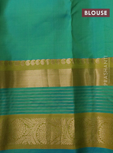 Pure kanchipuram silk saree green and dual shade of blue with allover zari woven stripe pattern and long rich zari woven border