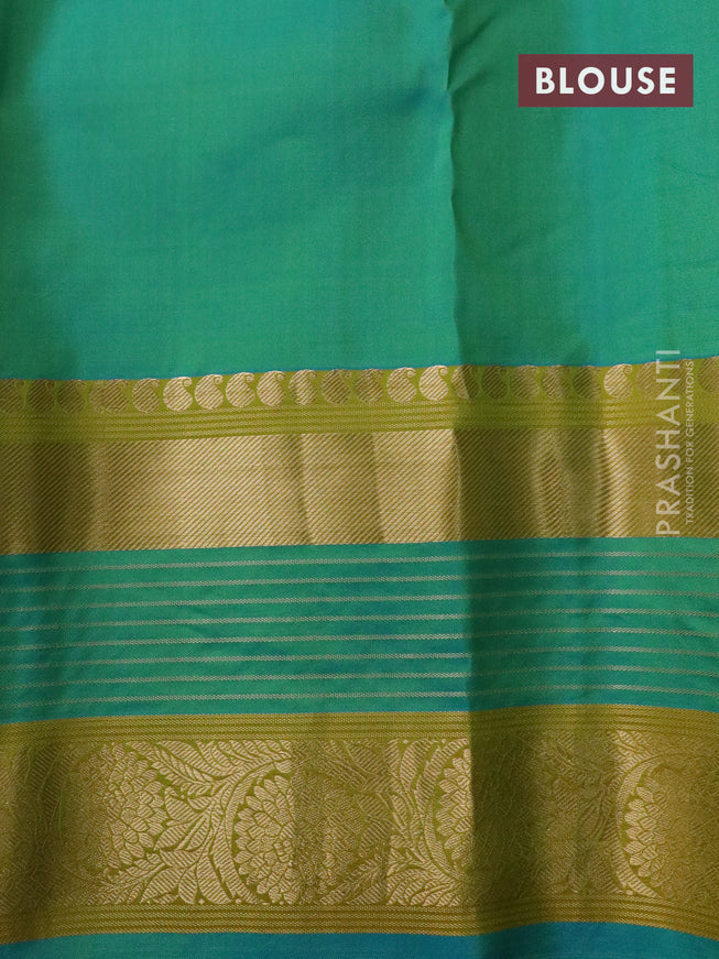 Pure kanchipuram silk saree green and dual shade of blue with allover zari woven stripe pattern and long rich zari woven border