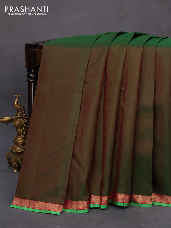 Pure kanchipuram silk saree dual shade of green and pink with plain body and small zari woven border