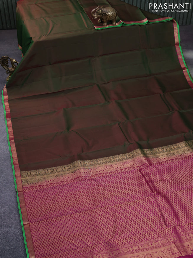 Pure kanchipuram silk saree dual shade of green and pink with plain body and small zari woven border