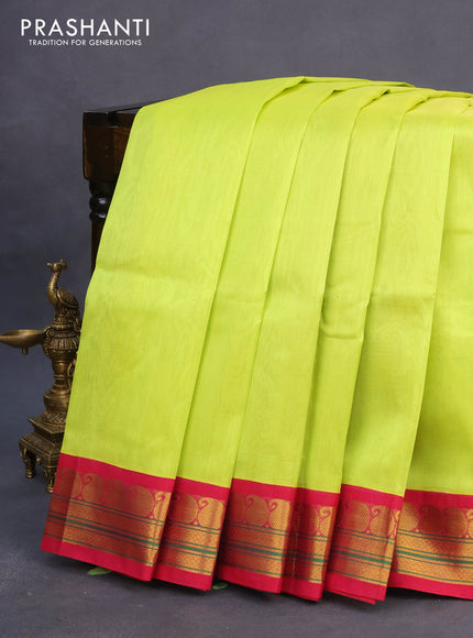 Silk cotton saree flourescent green and pink with plain body and paisleybzari woven korvai border