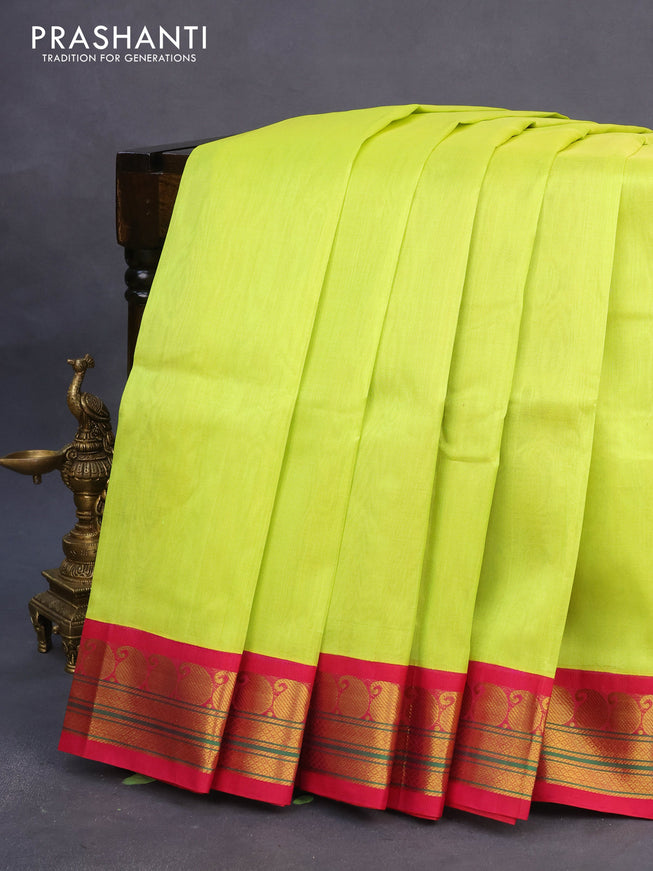 Silk cotton saree flourescent green and pink with plain body and paisleybzari woven korvai border