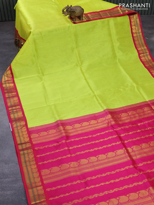 Silk cotton saree flourescent green and pink with plain body and paisleybzari woven korvai border