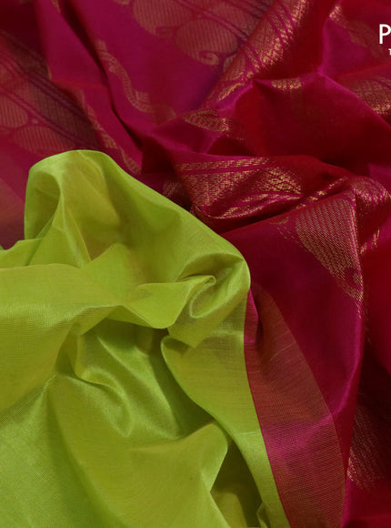 Silk cotton saree flourescent green and pink with plain body and paisleybzari woven korvai border