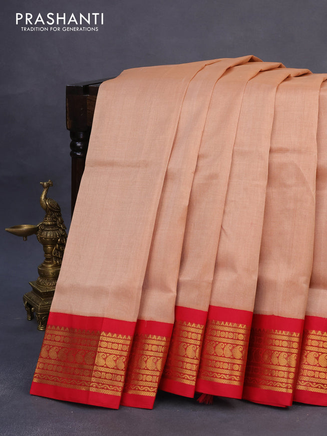 Silk cotton saree pastel peach and red with plain body and zari woven korvai border