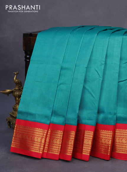 Silk cotton saree teal blue shade and red with plain body and zari woven korvai border