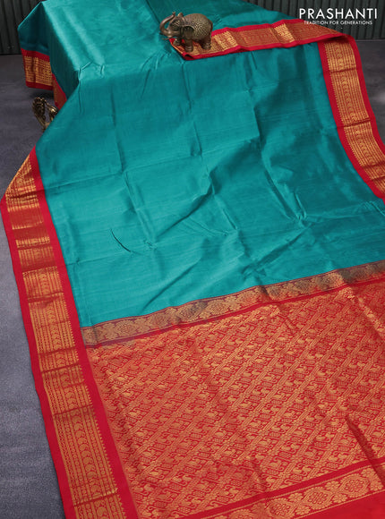 Silk cotton saree teal blue shade and red with plain body and zari woven korvai border