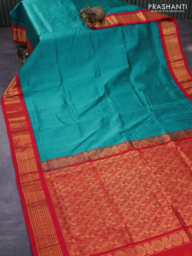 Silk cotton saree teal blue shade and red with plain body and zari woven korvai border