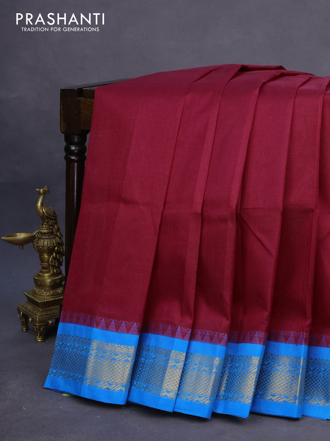 Silk cotton saree maroon and cs blue with plain body and zari woven korvai border