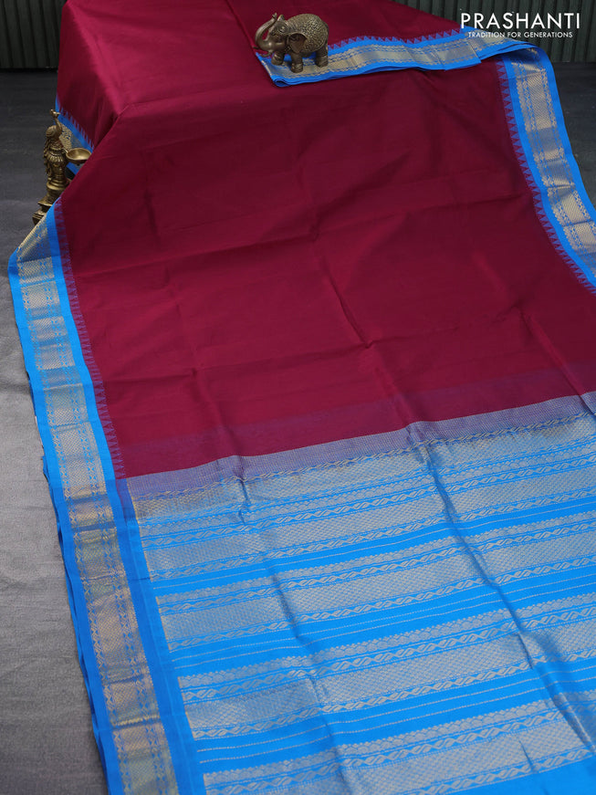 Silk cotton saree maroon and cs blue with plain body and zari woven korvai border