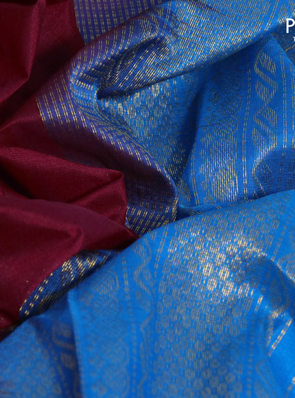 Silk cotton saree maroon and cs blue with plain body and zari woven korvai border