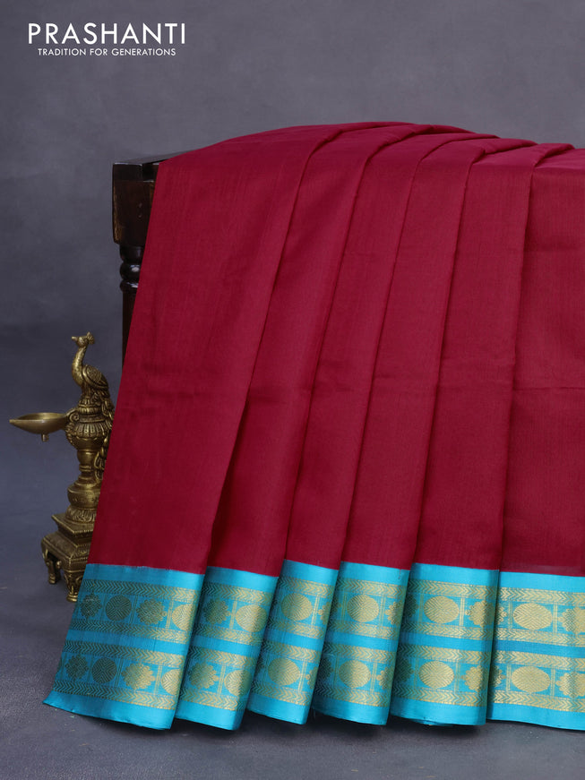 Kuppadam silk cotton saree kumkum red and teal blue with plain body and zari woven border