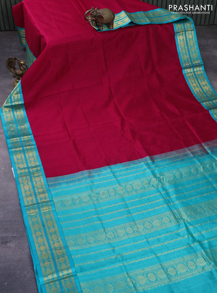 Kuppadam silk cotton saree kumkum red and teal blue with plain body and zari woven border