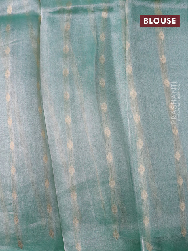 Banarasi tissue silk saree teal green shade with silver & gold zari weaves in borderless style