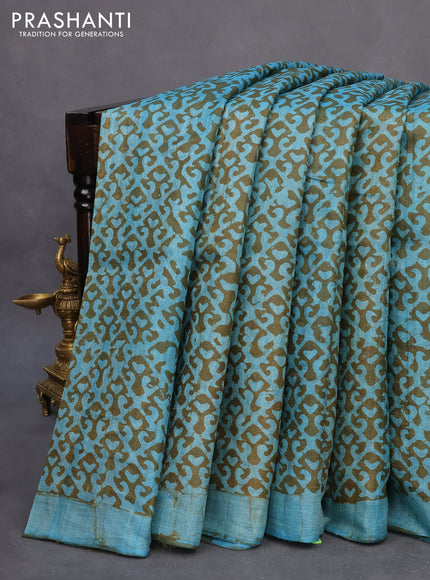 Pure tussar silk saree light blue and sap green with allover prints and simple border