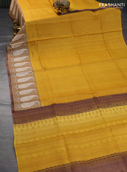 Pure tussar silk saree mustard yellow and sandal brown with allover stripe prints and paisley printed border