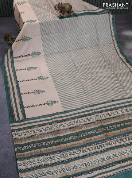 Pure tussar silk saree beige and green shade with allover prints and printed border