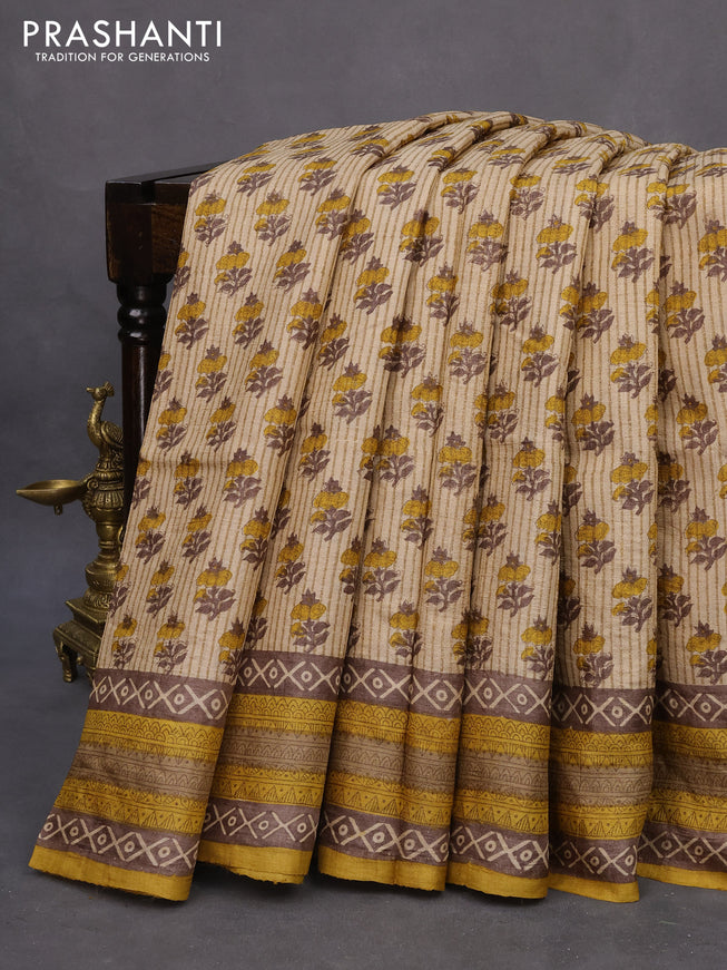 Pure tussar silk saree sandal and mustard yellow with allover floral butta prints and printed border