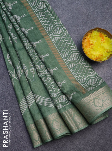 Semi dola saree pastel green shade with allover self emboss & prints and zari woven border