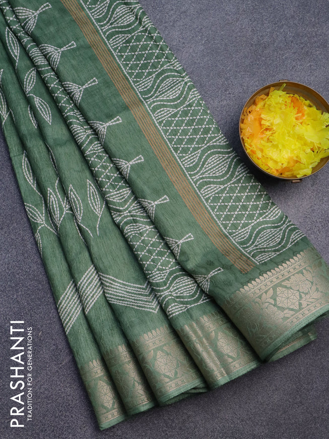 Semi dola saree pastel green shade with allover self emboss & prints and zari woven border