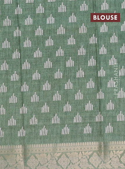 Semi dola saree pastel green shade with allover self emboss & prints and zari woven border