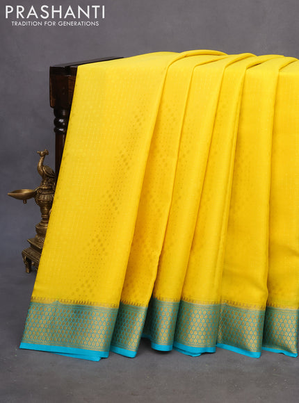 Pure mysore silk saree yellow and teal blue with allover self emboss and zari woven border