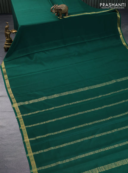 Pure mysore silk saree dark green with plain body and zari woven border