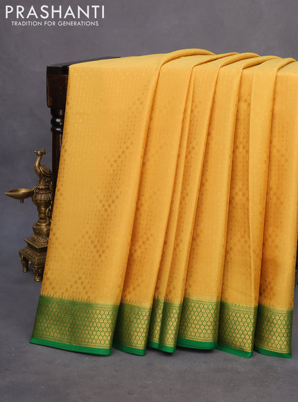 Pure mysore silk saree mustard yellow and green with allover self emboss and zari woven border