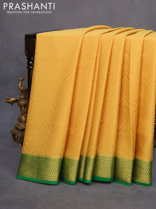 Pure mysore silk saree mustard yellow and green with allover self emboss and zari woven border