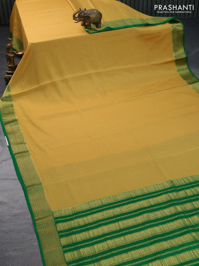 Pure mysore silk saree mustard yellow and green with allover self emboss and zari woven border