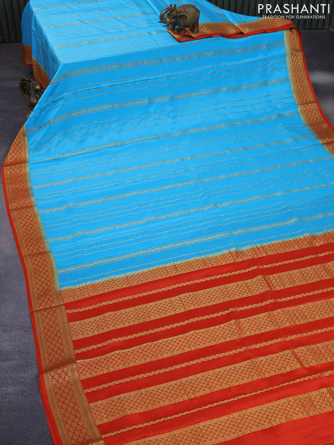 Pure mysore silk saree light blue and orange with allover zari weaves and rich zari woven border